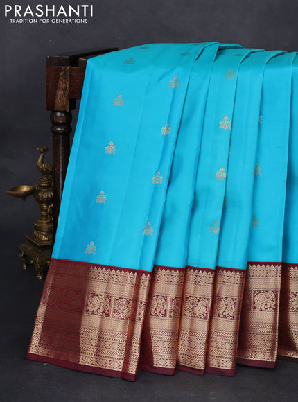 Pure kanchipuram silk saree teal blue and deep maroon with zari woven buttas and zari woven korvai border