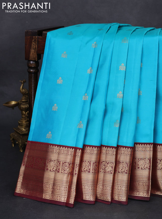 Pure kanchipuram silk saree teal blue and deep maroon with zari woven buttas and zari woven korvai border