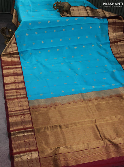 Pure kanchipuram silk saree teal blue and deep maroon with zari woven buttas and zari woven korvai border