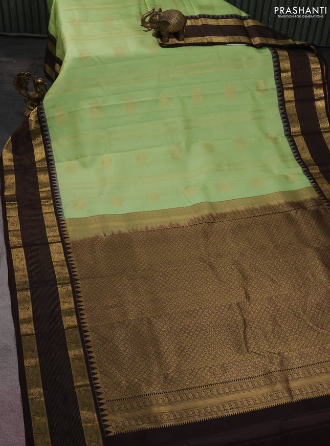Pure kanchipuram silk saree pista green and brown with allover zari weaves & buttas and zari woven border