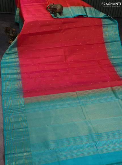 Pure kanchipuram silk saree dual shade of pinkish orange and teal blue with zari woven buttas and rich zari border
