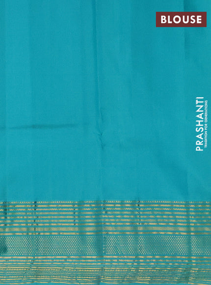 Pure kanchipuram silk saree dual shade of pinkish orange and teal blue with zari woven buttas and rich zari border