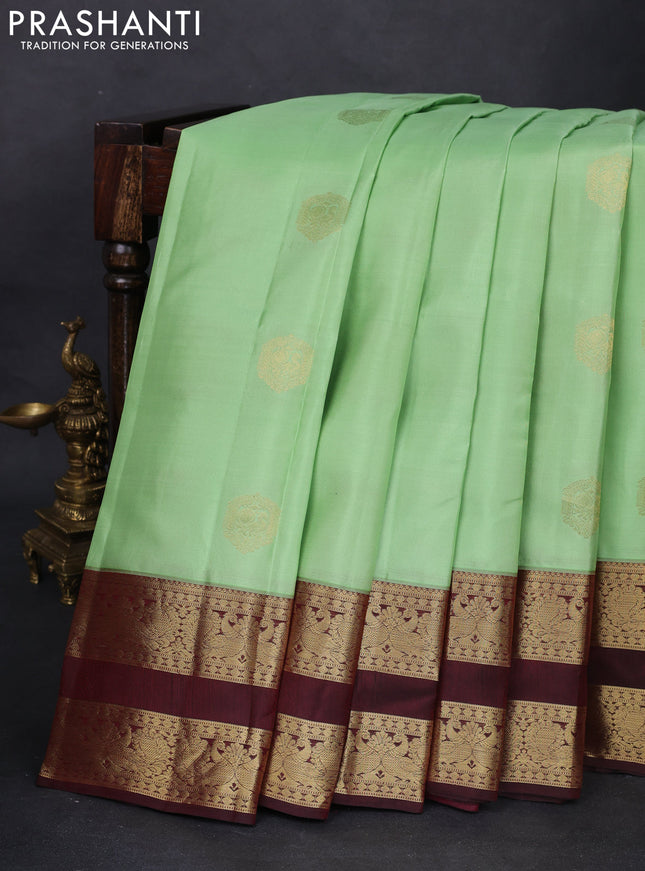 Pure kanchipuram silk saree pista green and deep maroon with zari woven buttas and rettapet zari woven korvai border