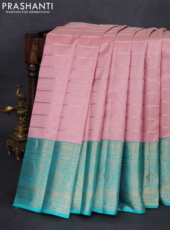 Pure kanchipuram silk saree peach shade and teal blue with allover zari woven stripes pattern and zari woven border