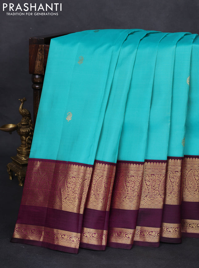 Pure kanchipuram silk saree teal blue and wine shade with zari woven buttas and zari woven korvai border