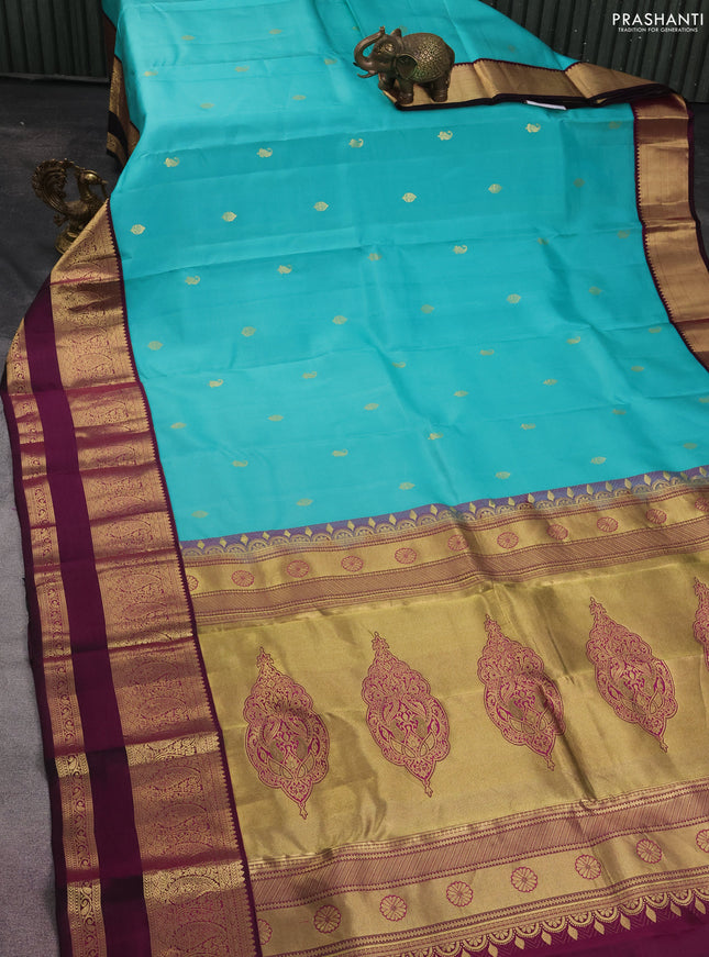 Pure kanchipuram silk saree teal blue and wine shade with zari woven buttas and zari woven korvai border