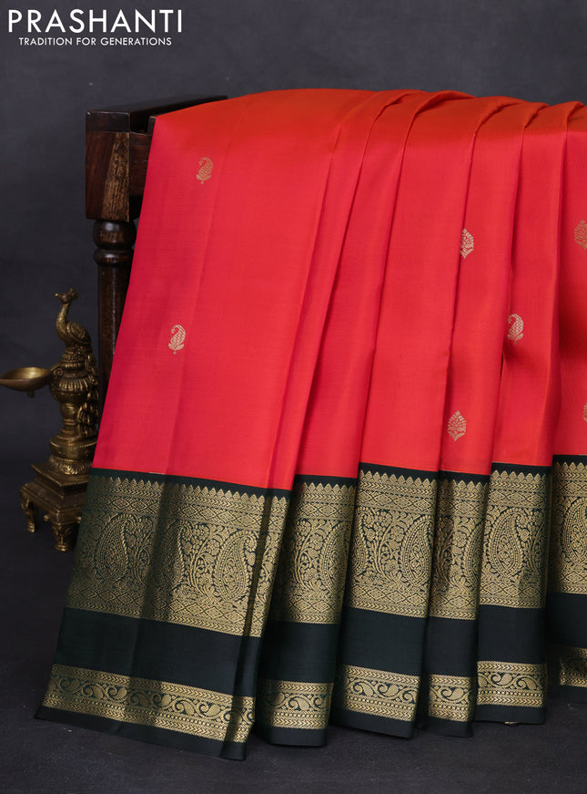 Pure kanchipuram silk saree dual shade of pinkish orange and bottle green with zari woven buttas and zari woven korvai border