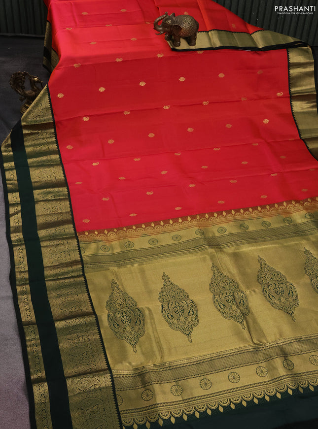 Pure kanchipuram silk saree dual shade of pinkish orange and bottle green with zari woven buttas and zari woven korvai border