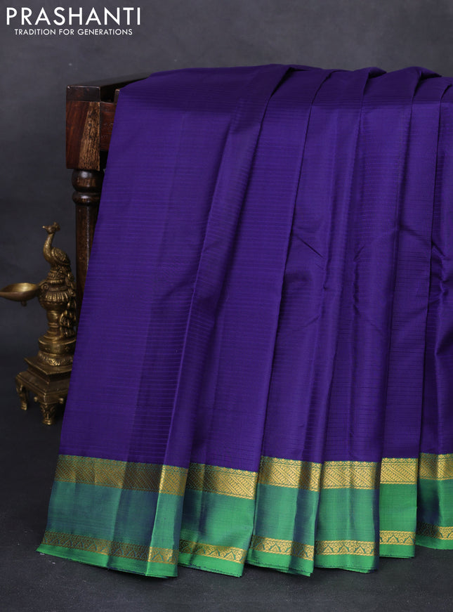 Pure kanchipuram silk saree blue and green with plain body and rettapet zari woven border