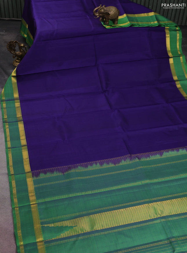 Pure kanchipuram silk saree blue and green with plain body and rettapet zari woven border