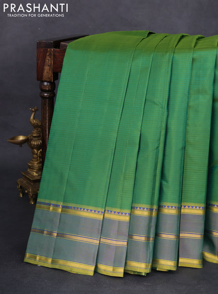 Pure kanchipuram silk saree green and mustard shade with stripes pattern and simple zari border