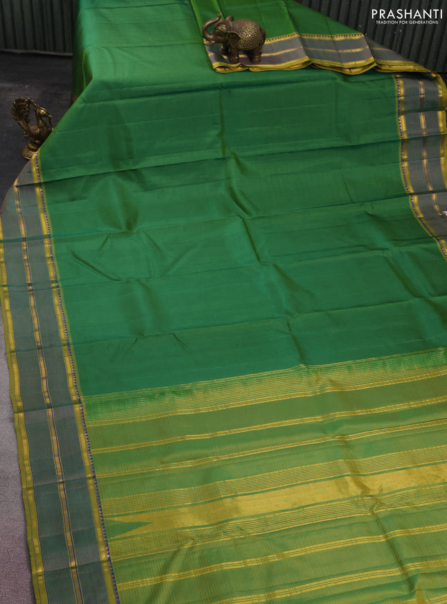 Pure kanchipuram silk saree green and mustard shade with stripes pattern and simple zari border