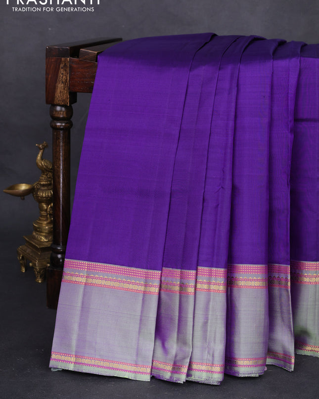 Pure kanchipuram silk saree violet and pastel green with plain body and rettapet zari woven border