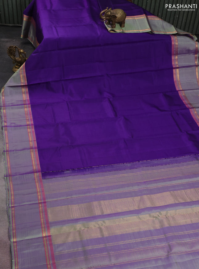 Pure kanchipuram silk saree violet and pastel green with plain body and rettapet zari woven border