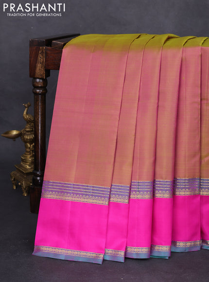 Pure kanchipuram silk saree dual shade of greenish pink and peacock green with plain body and rettapet zari woven border