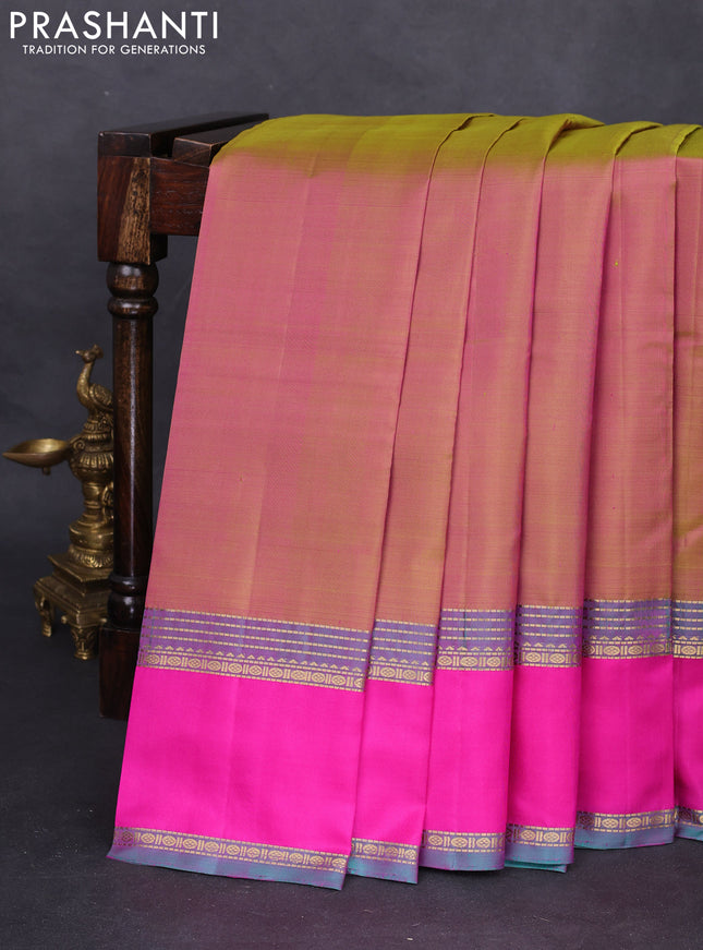 Pure kanchipuram silk saree dual shade of greenish pink and peacock green with plain body and rettapet zari woven border