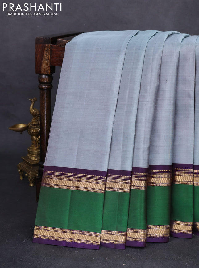Pure kanchipuram silk saree pastel blue and deep jamun with plain body and rettapet zari woven border