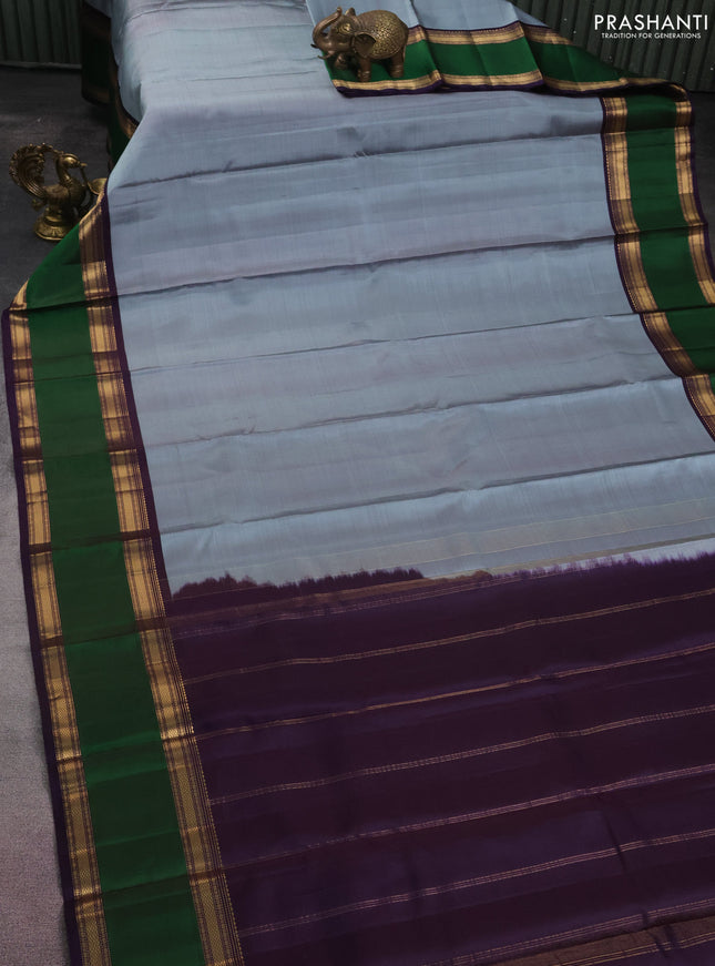 Pure kanchipuram silk saree pastel blue and deep jamun with plain body and rettapet zari woven border