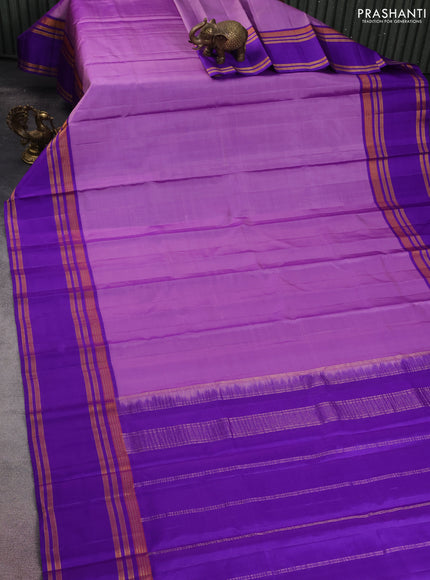 Pure kanchipuram silk saree lavender and blue with plain body and rettapet zari woven border