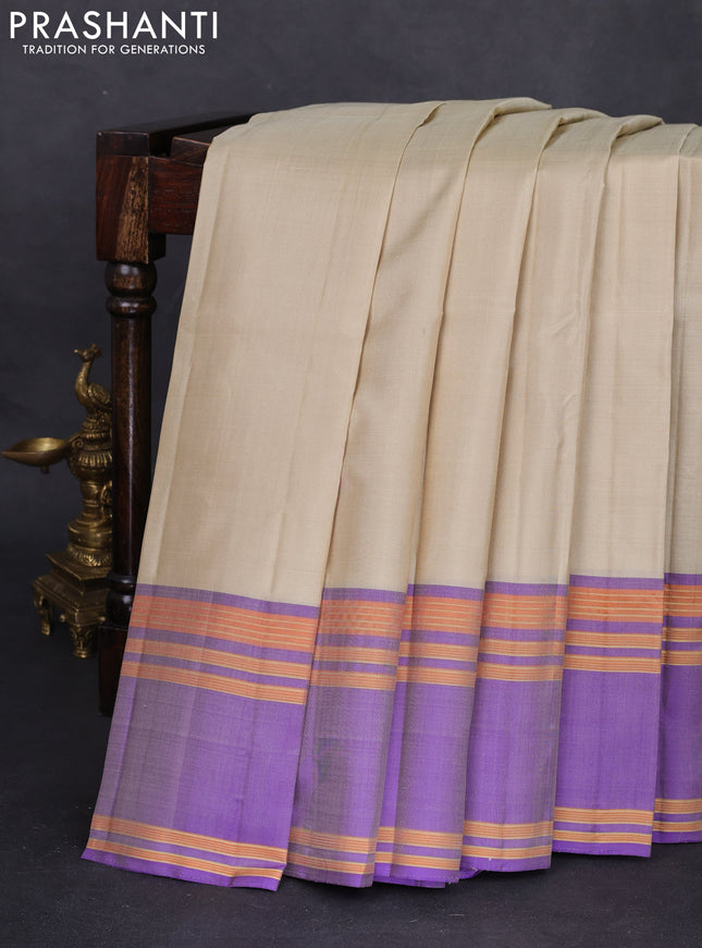Pure kanchipuram silk saree cream and violet with plain body and rettapet zari woven border