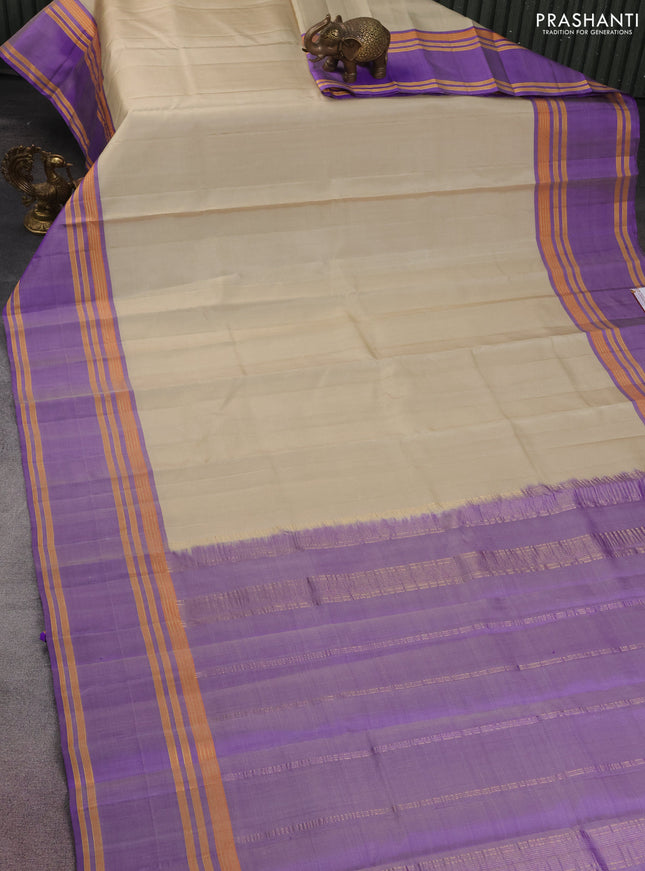 Pure kanchipuram silk saree cream and violet with plain body and rettapet zari woven border