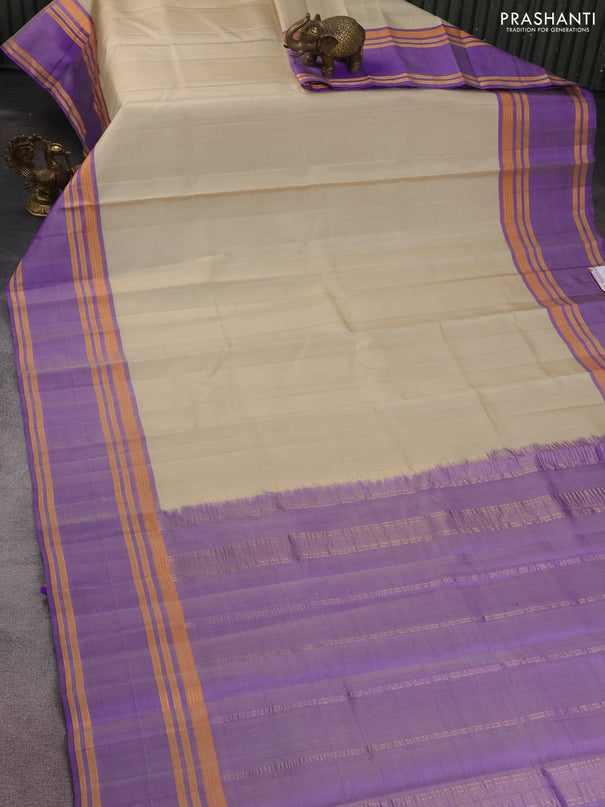 Pure kanchipuram silk saree cream and violet with plain body and rettapet zari woven border