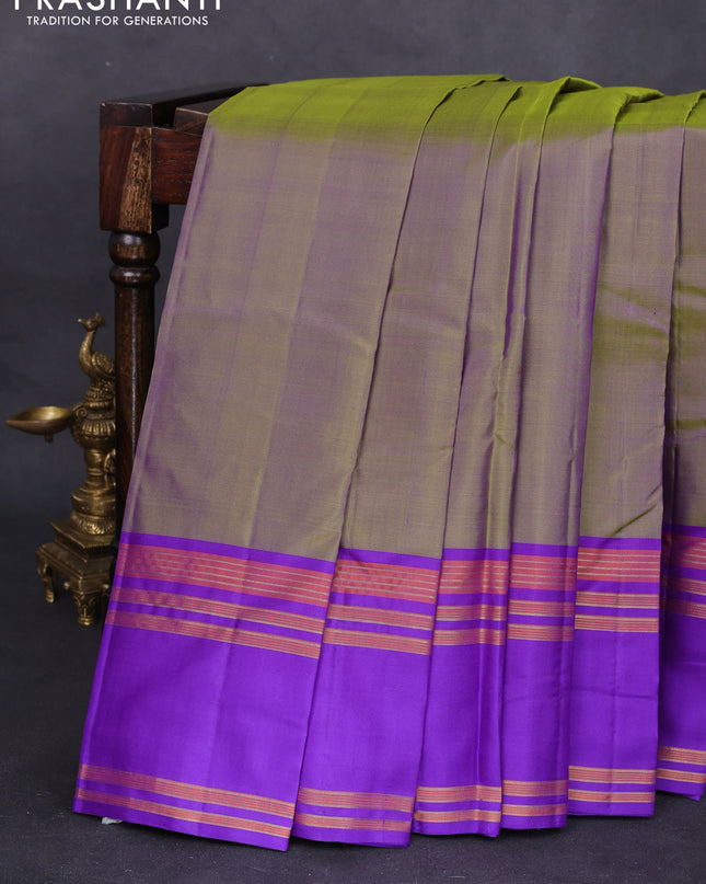 Pure kanchipuram silk saree dual shade of green and blue with plain body and rettapet zari woven border