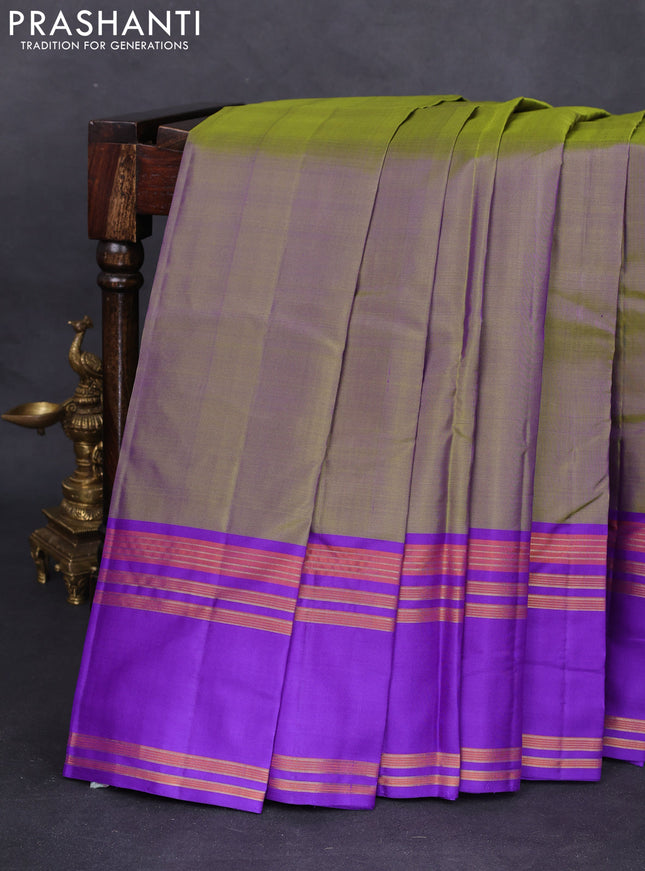 Pure kanchipuram silk saree dual shade of green and blue with plain body and rettapet zari woven border