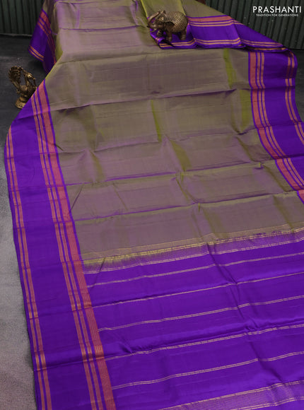 Pure kanchipuram silk saree dual shade of green and blue with plain body and rettapet zari woven border