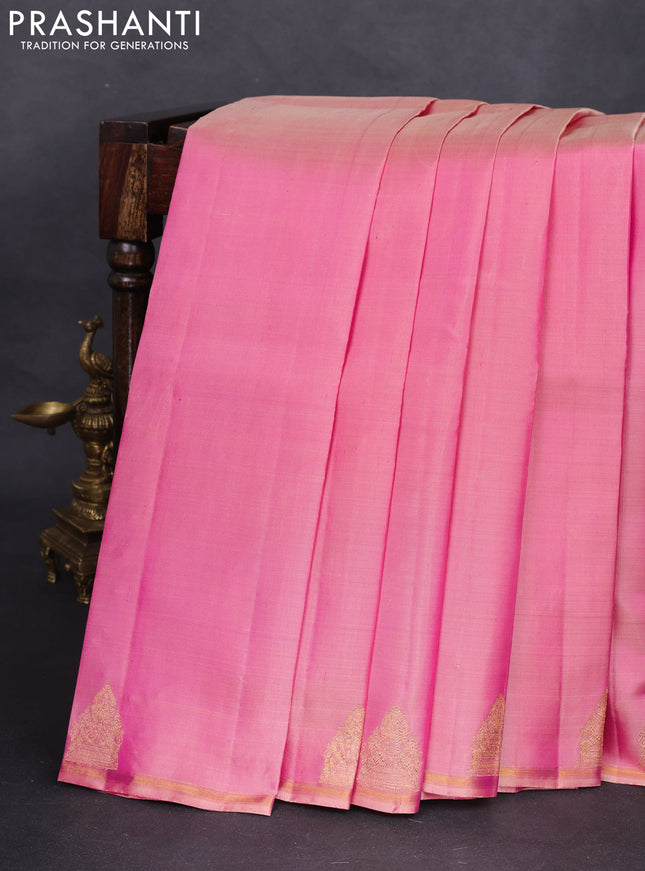 Pure kanchipuram silk saree dual shade of pastel pink with plain body and zari woven butta border