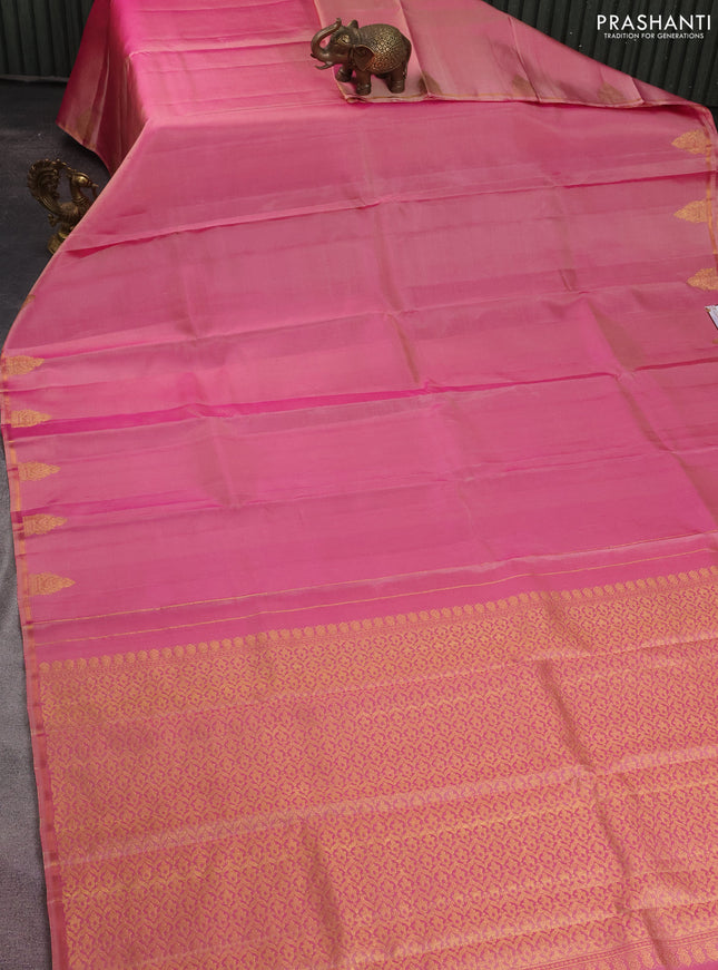 Pure kanchipuram silk saree dual shade of pastel pink with plain body and zari woven butta border
