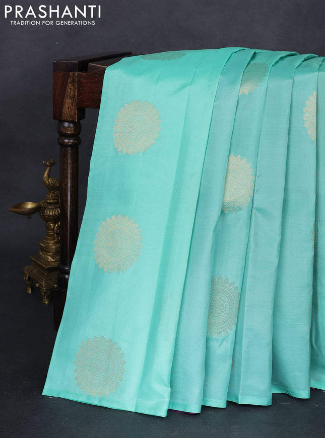 Pure kanchipuram partly silk saree teal green and red purple with zari woven buttas in borderless style