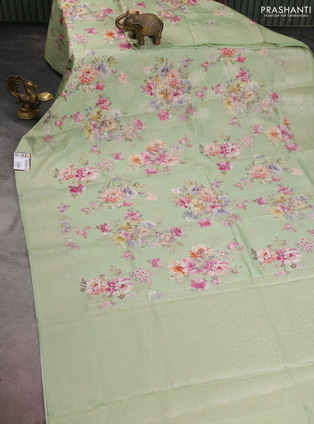 Chiniya silk saree pastel green with allover silver zari buttas & floral digital prints and zari woven border
