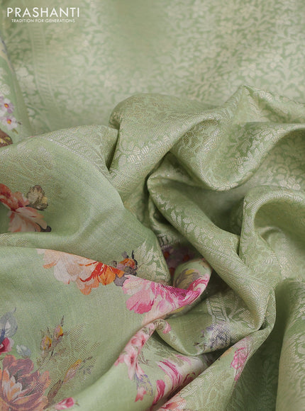 Chiniya silk saree pastel green with allover silver zari buttas & floral digital prints and zari woven border