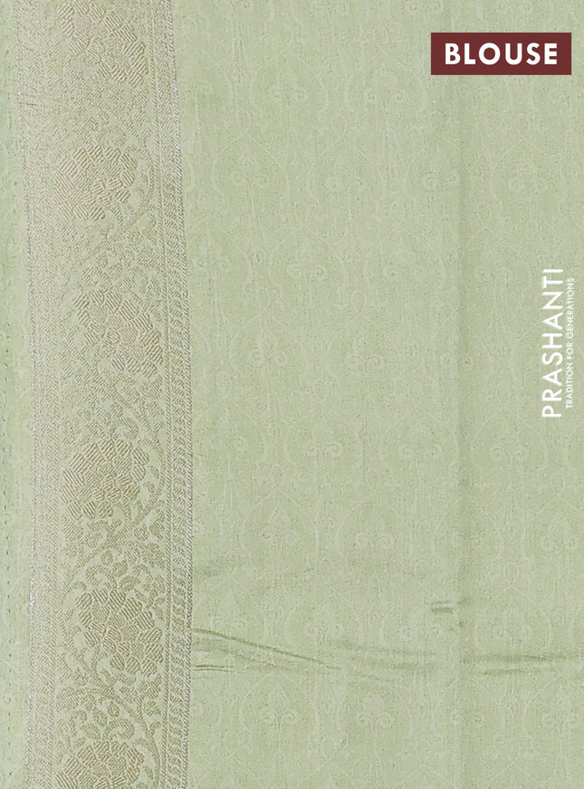 Chiniya silk saree pastel green with allover silver zari buttas & floral digital prints and zari woven border