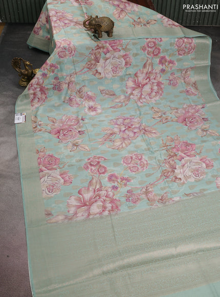 Chiniya silk saree teal blue shade with allover zari buttas & floral digital prints and woven border