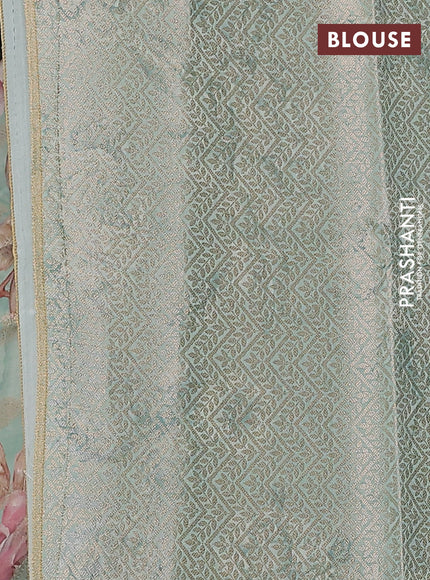 Chiniya silk saree teal blue shade with allover zari buttas & floral digital prints and woven border