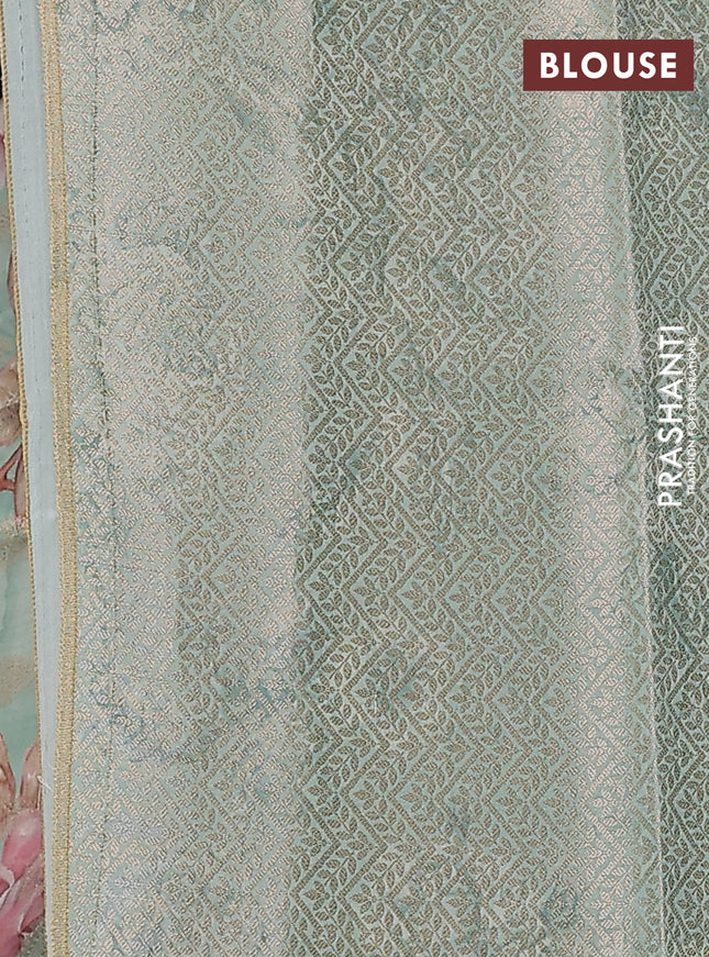 Chiniya silk saree teal blue shade with allover zari buttas & floral digital prints and woven border