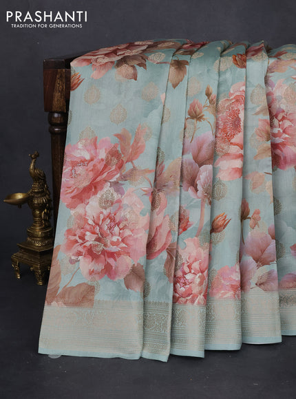 Chiniya silk saree pastel blue with allover zari weaves & floral digital prints and woven border