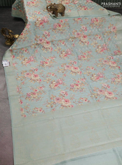 Chiniya silk saree pastel blue shade with allover zari buttas & floral digital prints and woven border