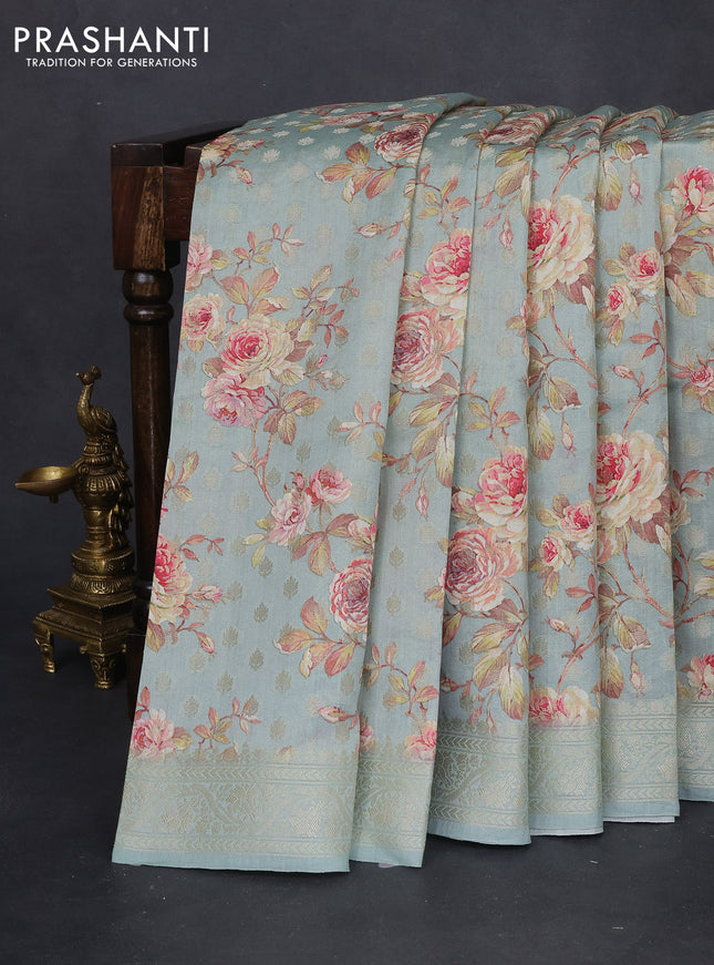 Chiniya silk saree pastel blue with allover zari buttas & floral digital prints and woven border