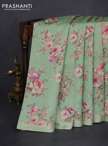 Chiniya silk saree teal green shade with allover floral digital prints and zari woven border