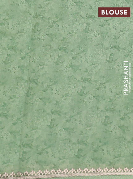 Chiniya silk saree teal green shade with allover floral digital prints and zari woven border