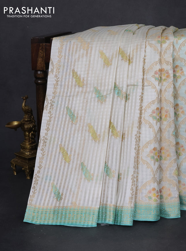 Chiniya silk saree off white and teal blue with allover zari weaves & digital prints and zari woven border