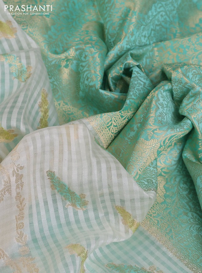 Chiniya silk saree off white and teal blue with allover zari weaves & digital prints and zari woven border