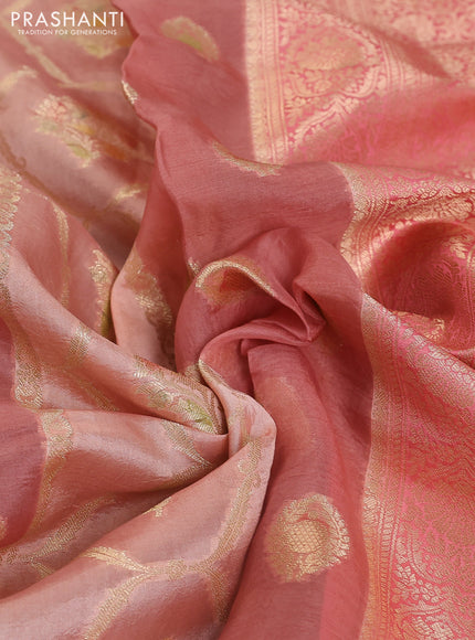 Chiniya silk saree pastel peach orange with allover zari weaves & digital prints and zari woven border