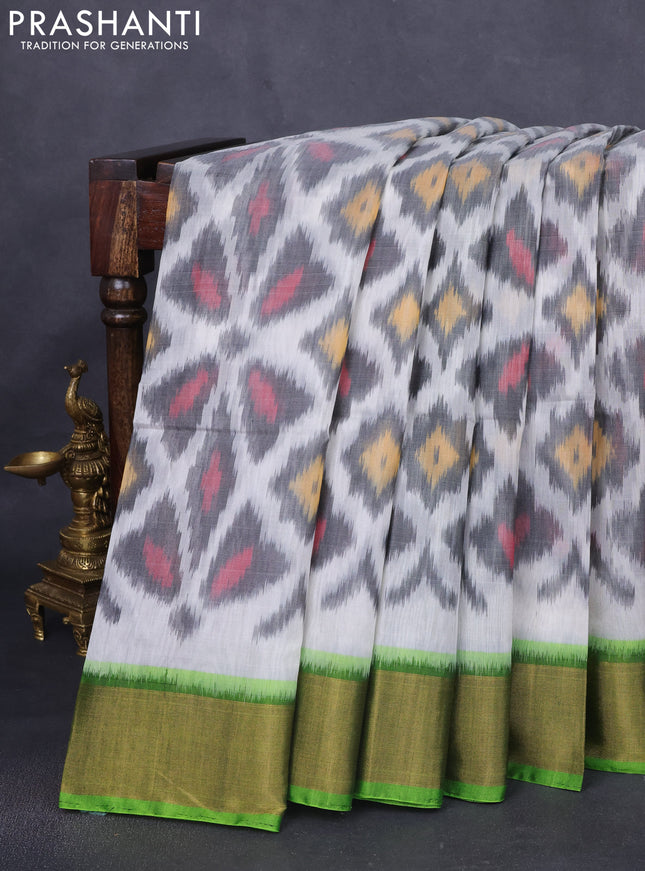 Ikat silk cotton saree off white and green with allover ikat weaves and zari woven border
