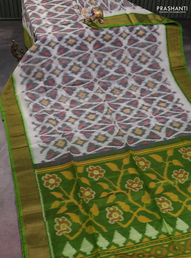 Ikat silk cotton saree off white and green with allover ikat weaves and zari woven border