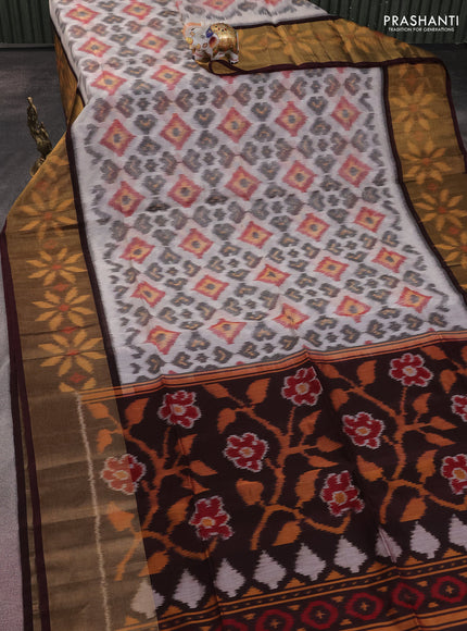 Ikat silk cotton saree cream and coffee brown with allover ikat weaves and long zari woven ikat border