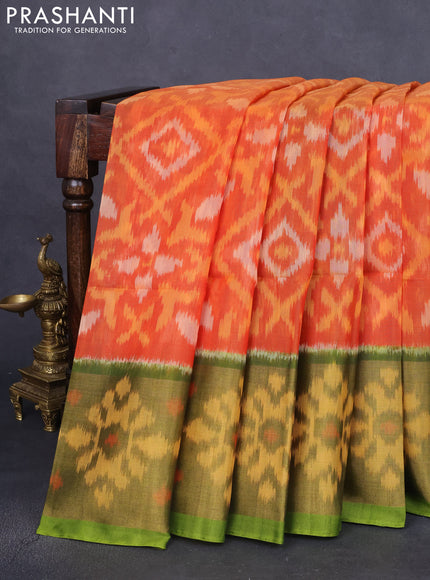 Ikat silk cotton saree sun set orange and green with allover ikat weaves and long zari woven ikat border
